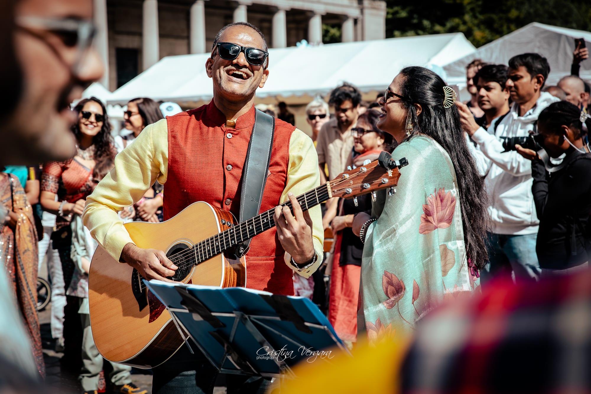 Rahul Venkit playing guitar on stage