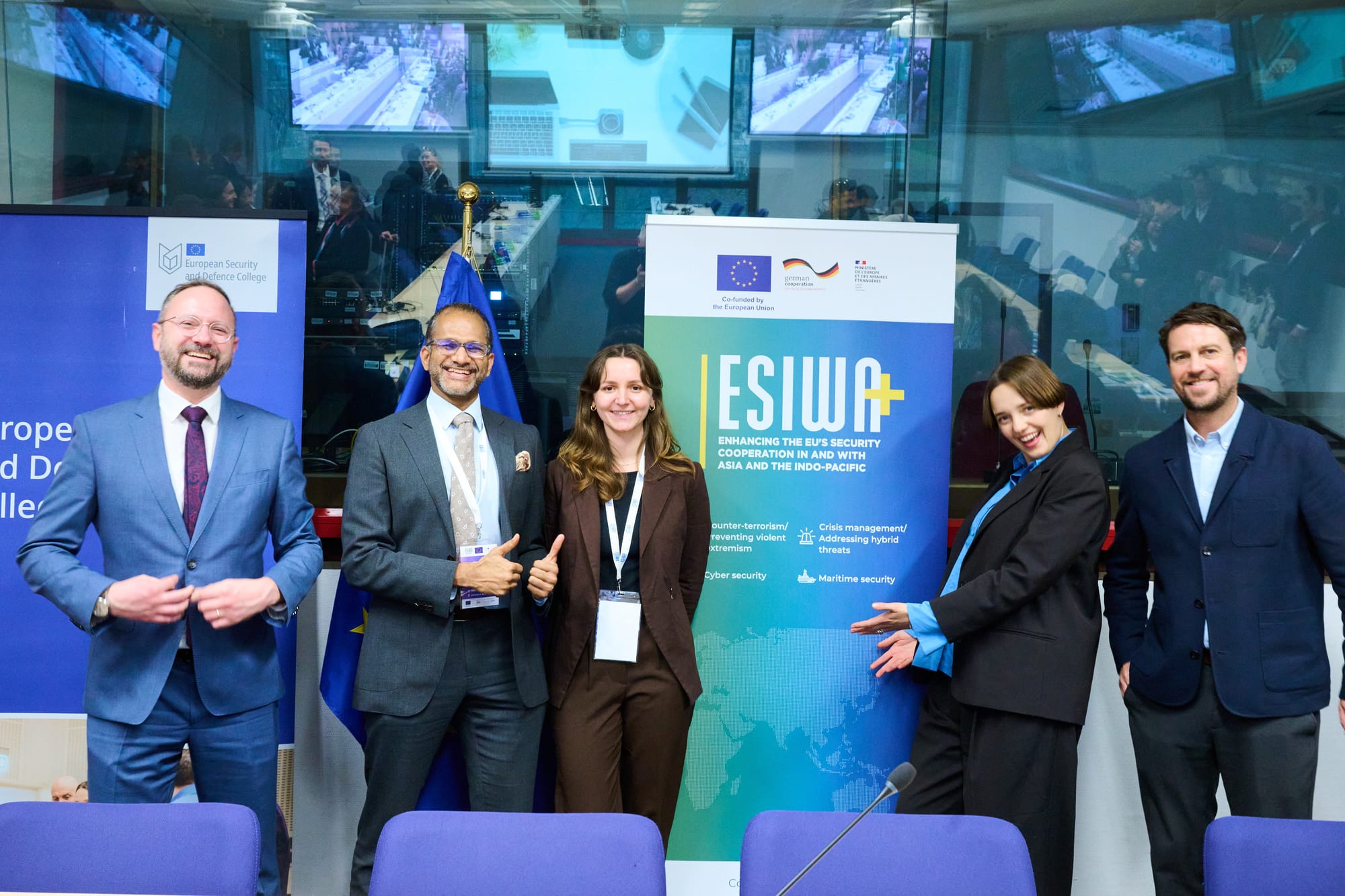 Group photo with an ESIWA+ banner at the European Security and Defence College